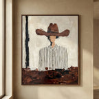 Oversized western cowboy painting bringing bold southwestern rustic character over a leather Chesterfield sofa.