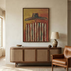 Warm color cowboy portrait plaster art adding retro Southwestern charm to a home office reading corner next to a leather armchair