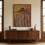 Bold Western cowboy abstract canvas displayed above a dark wood sideboard in a mid century dining space