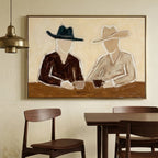 Abstract Western cowboy figure artwork mounted over a rustic reclaimed wood console table in a sunlit entryway foyer