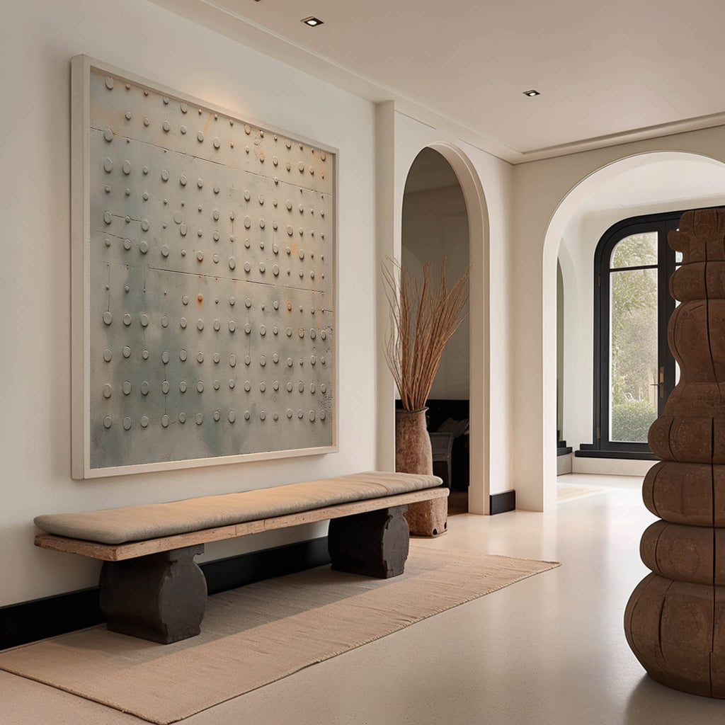 Minimalist 3D plaster painting styled above a neutral fabric sofa in a luxury living room
