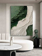 Modern minimalist emerald green canvas painting styled above a contemporary sofa in a luxury living room