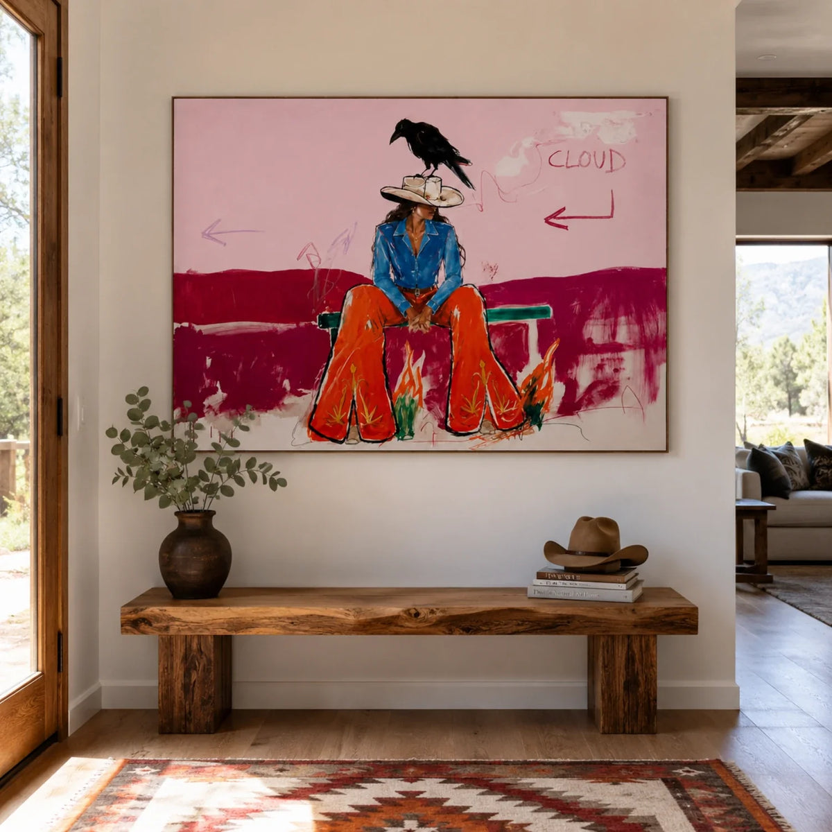 Vibrant pink Western figure canvas decor framed above a light wood dresser in a chic coastal bedroom