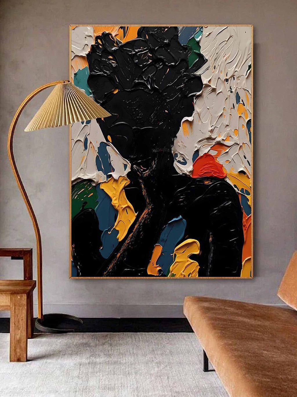 Contemporary thick texture black figure art piece enhancing the gallery wall of a luxury dining room area.