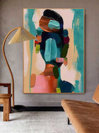 Contemporary abstract female silhouette art piece enhancing the gallery wall of a stylish dining room area.