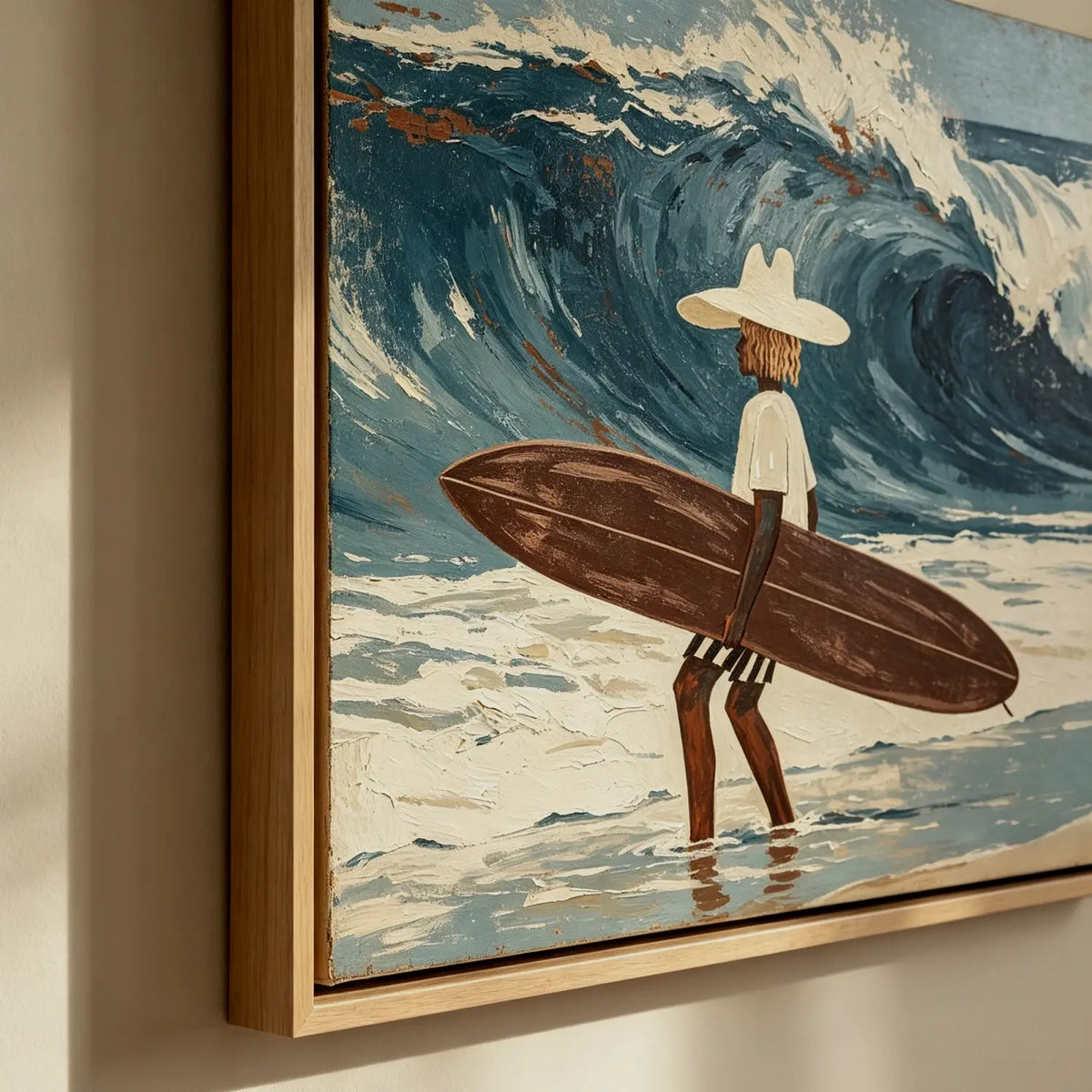 Vintage coastal surfer ocean canvas painting displayed above a white slipcovered sofa in a modern beach house living room