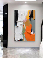 minimalist entryway wall display with framed bright abstract geometric artwork