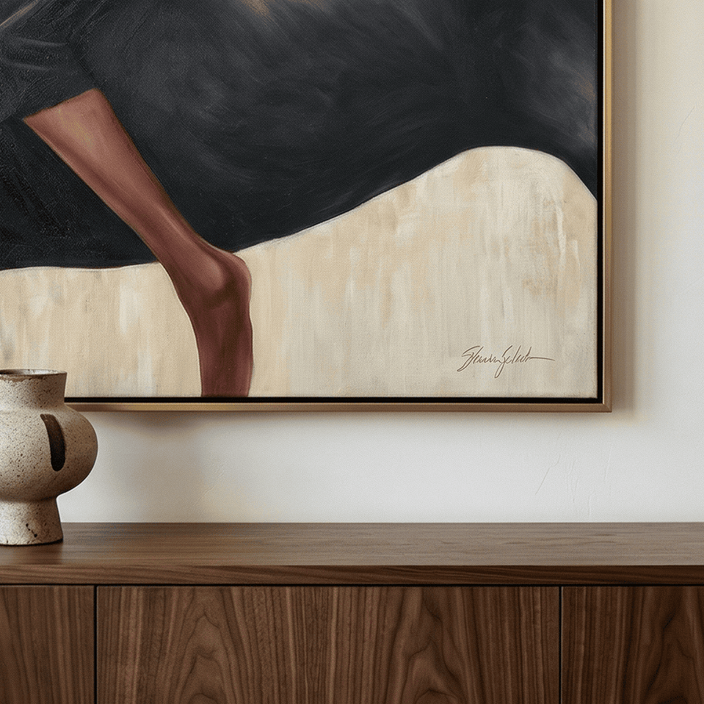 Beige and black equestrian wall art catching soft natural light in a sunlit breakfast nook corner
