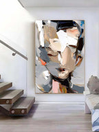 Modern heavy palette knife face wall art styled above a contemporary minimalist sofa in a luxury living room