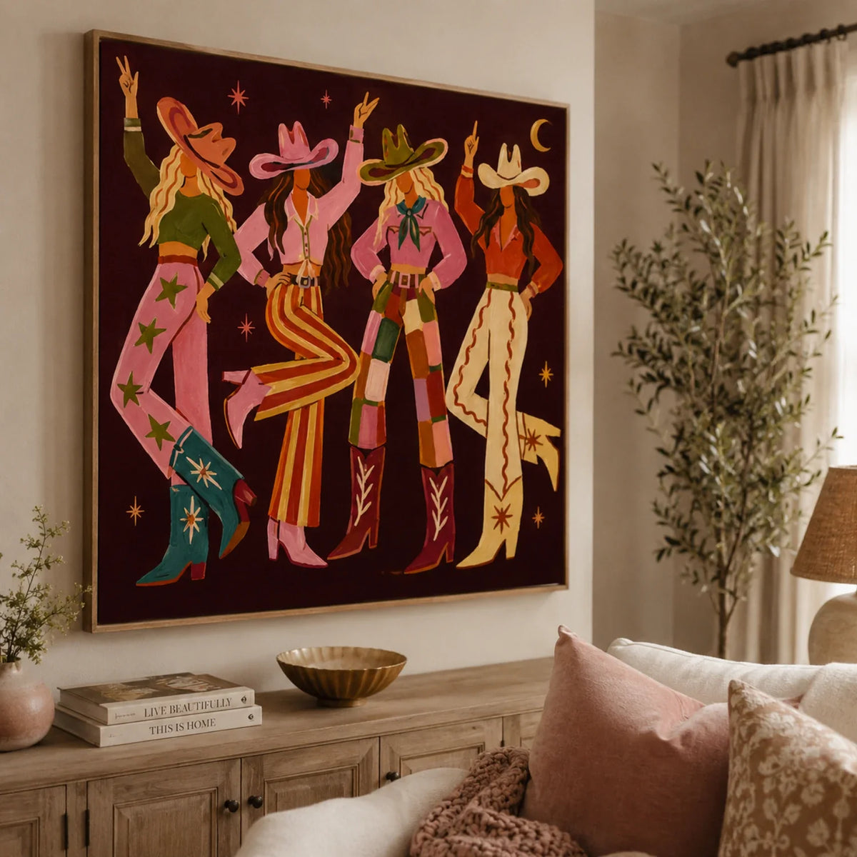 Retro western vintage figure textured canvas wall art hanging above a sofa in a modern boho living room