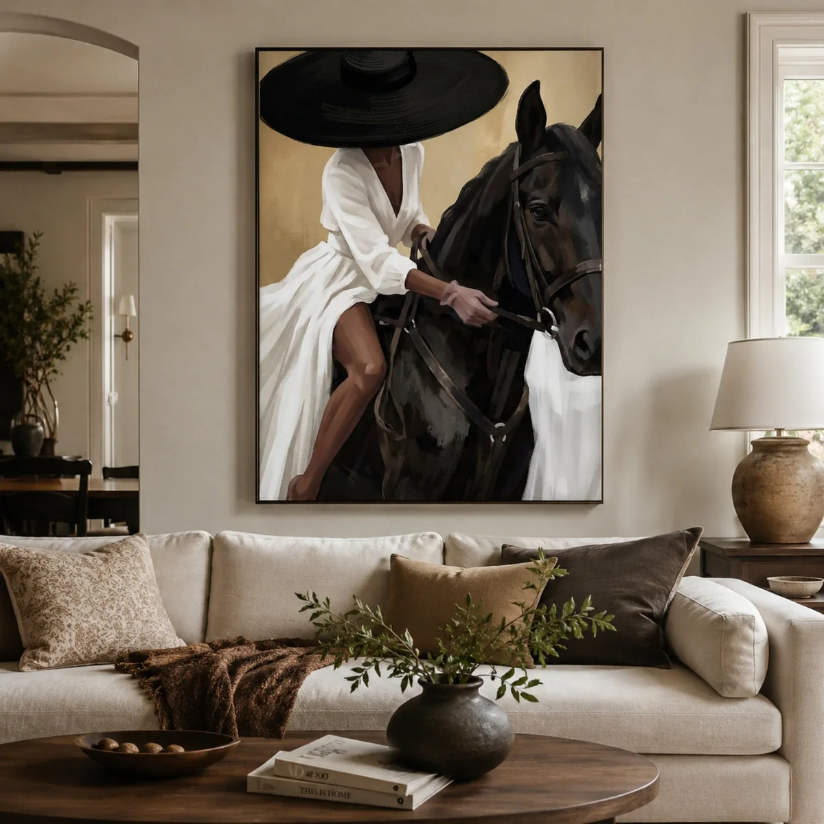 Stylish Southwestern equestrian canvas wall decor framed above an upholstered headboard in a master bedroom