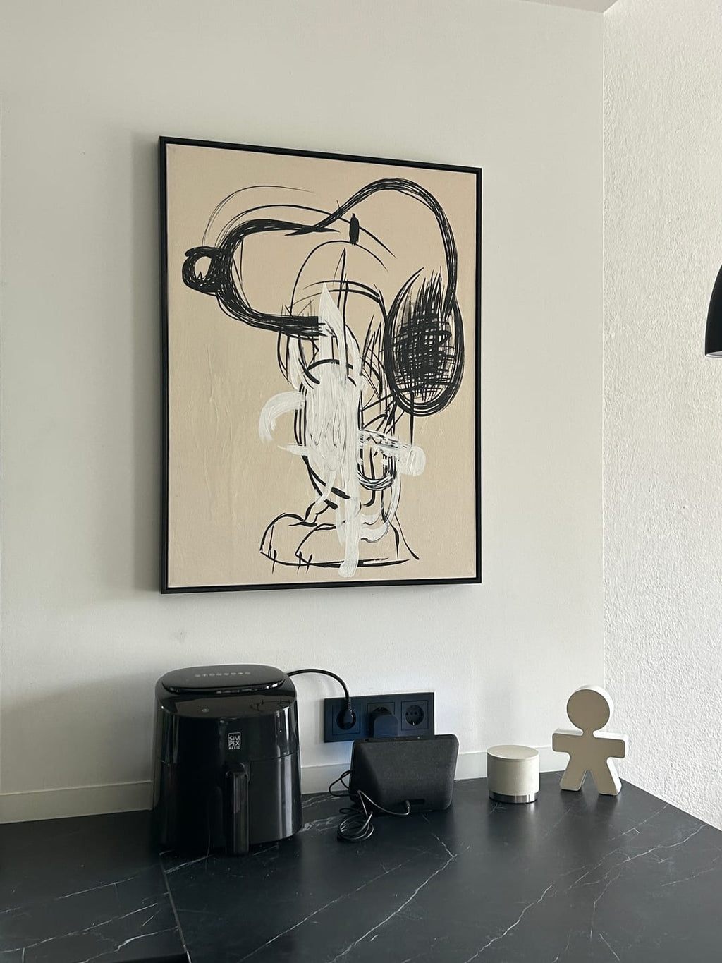 A large framed abstract beige line wall art print with a beige background hangs on a Children's Room wall.