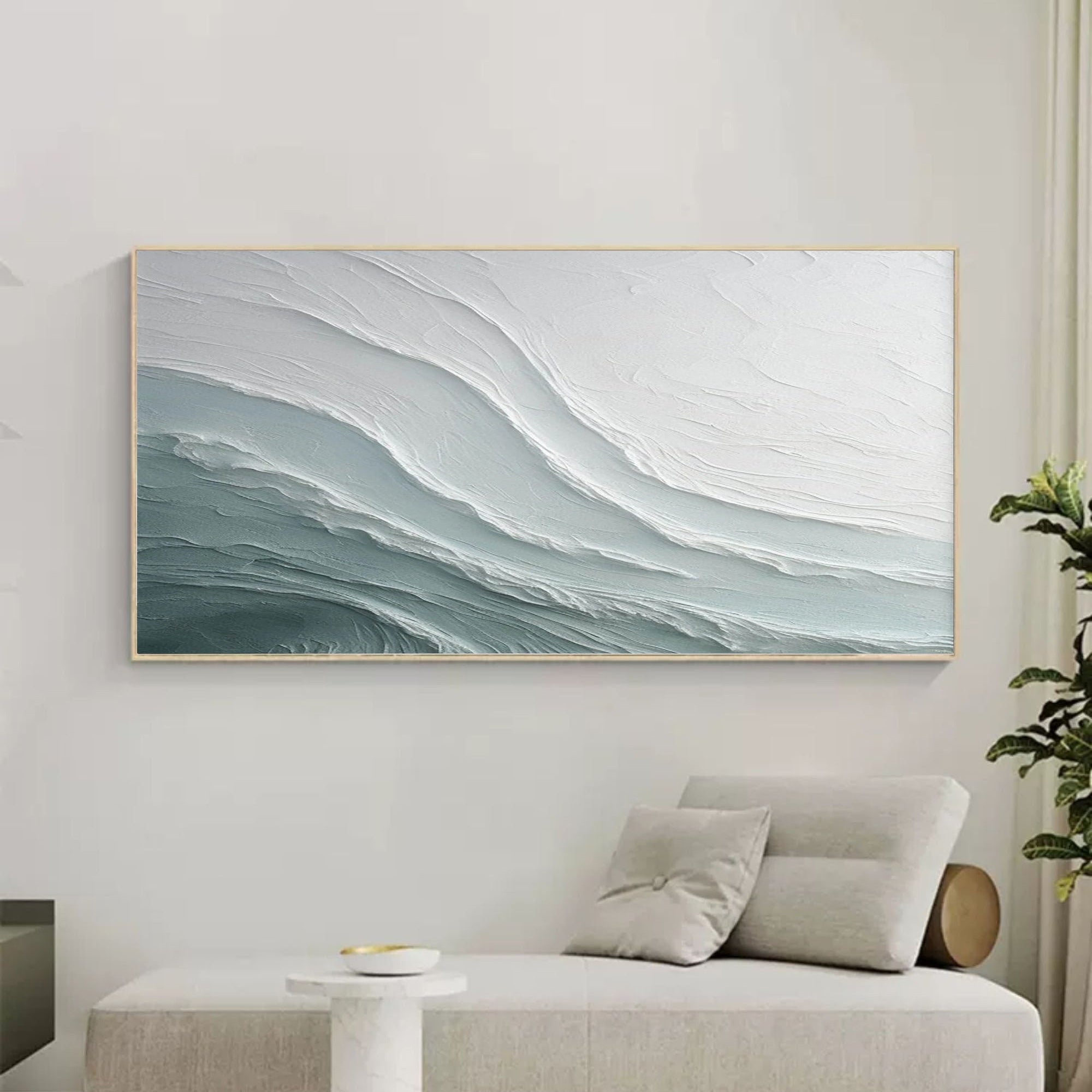 Textured abstract wave canvas artwork in serene bedroom with soft natural lighting