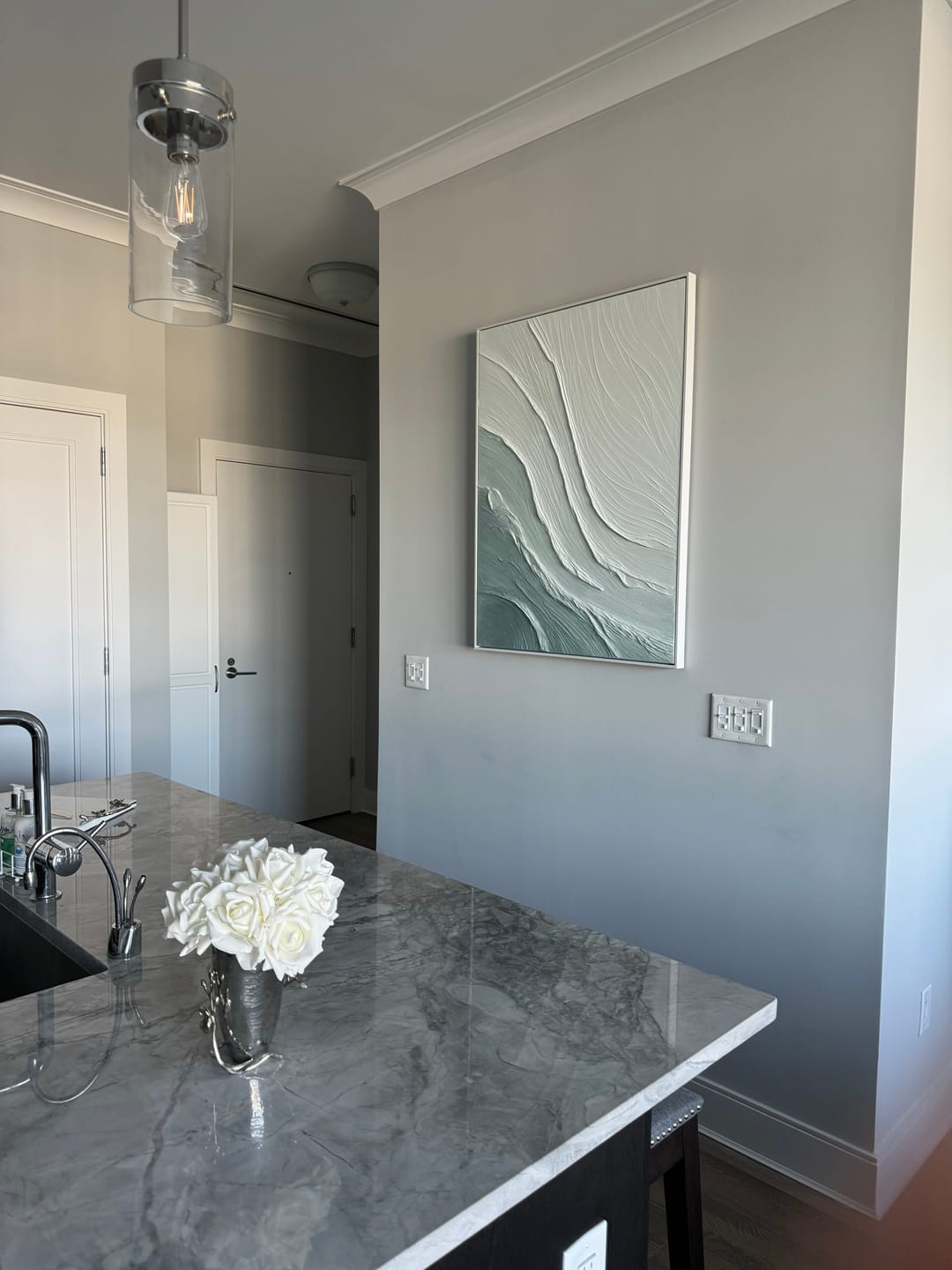 Ebb Wabi-Sabi Textured Wall Art hanging in a cozy dining room with neutral bedding and wooden accents