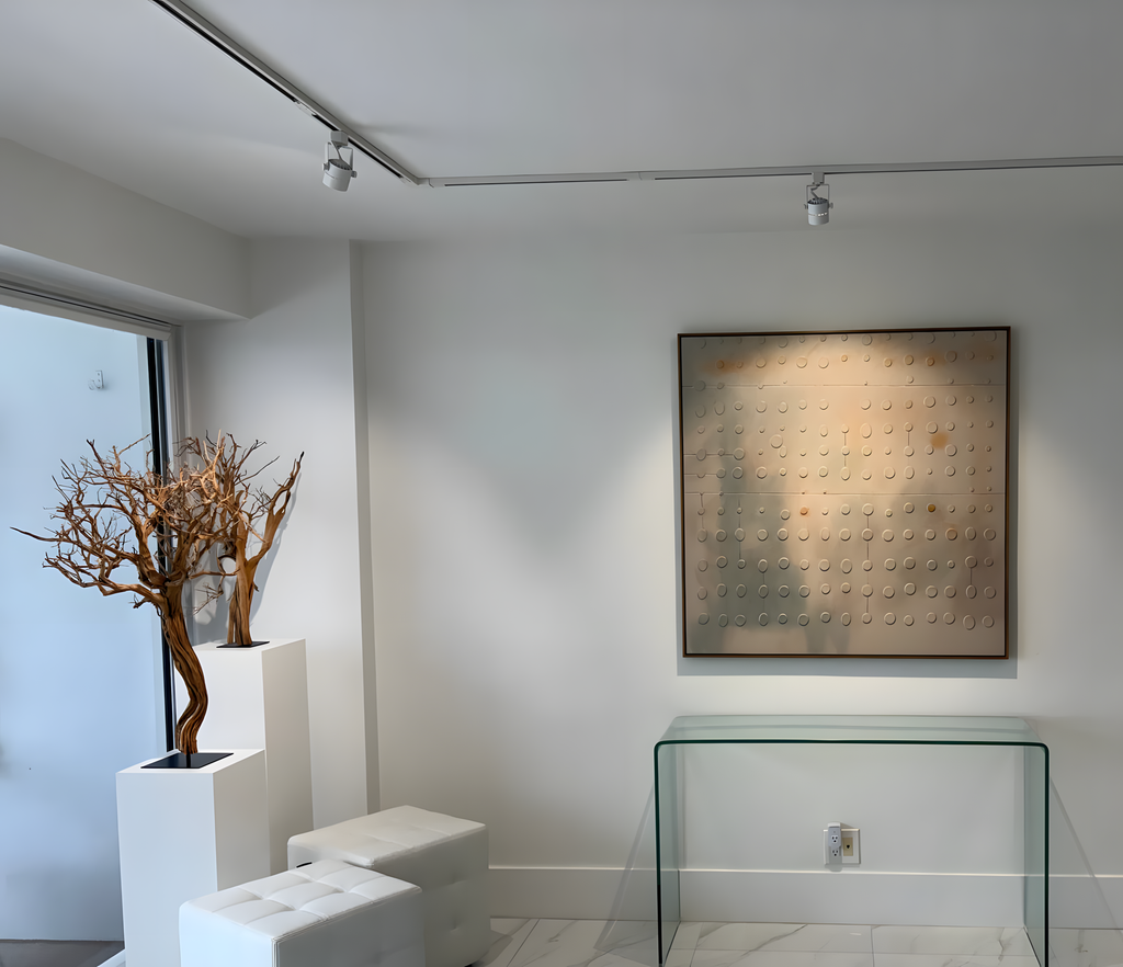 A warm-gray Wabi-sabi textured wall art painting hanging on the wall of a modern-style dining room.