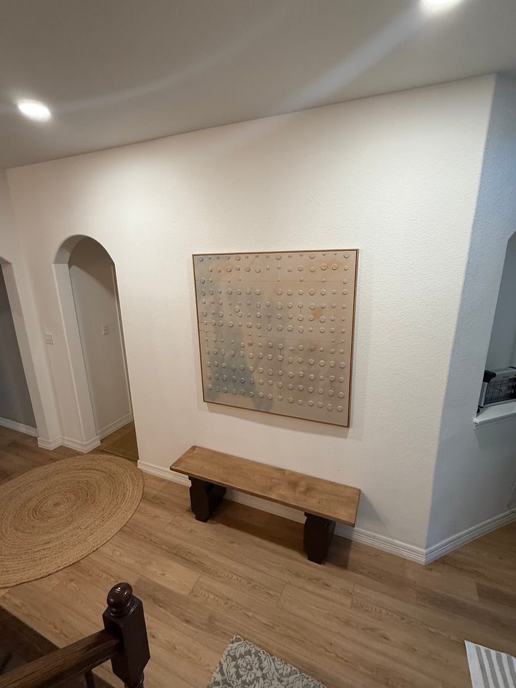 Large Wabi Sabi textured wall art painting, hung on the bench in the hallway.