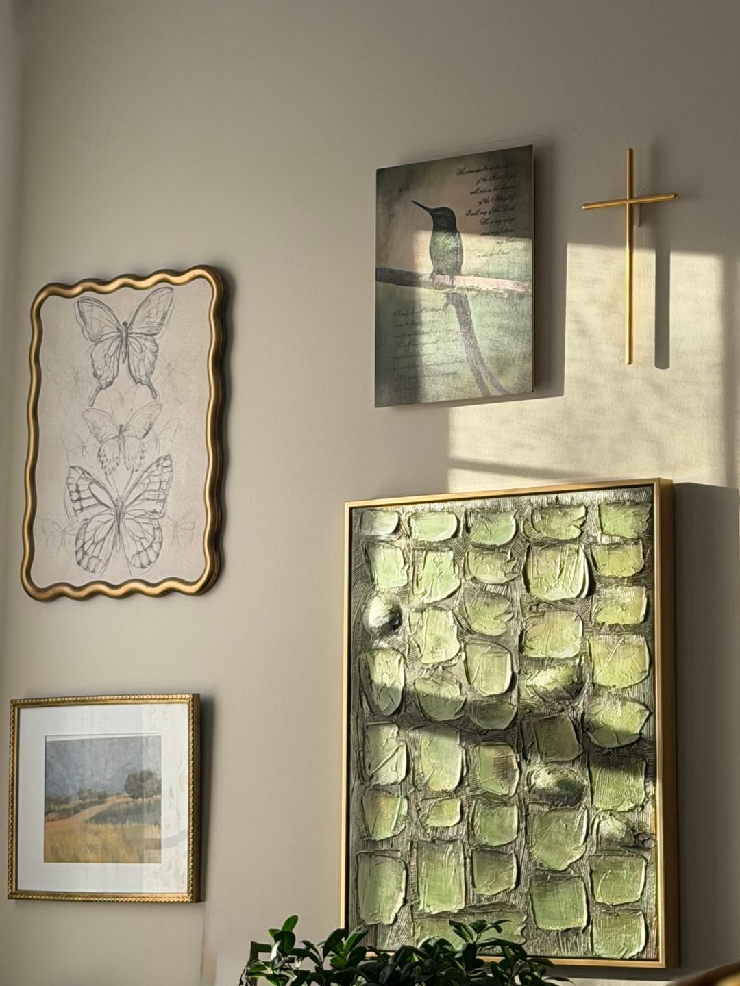 Contemporary textured plant motif art piece enhancing the gallery wall of a sleek dining room area.