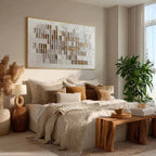 Large minimalist neutral geometric canvas artwork with gold leaf beautifully framed above a rustic living room sofa.