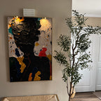 Vibrant heavy palette knife textured portrait painting creating a powerful artistic statement in an entryway.