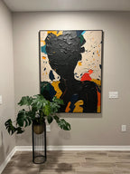 Creative heavy textured painting adding bold inspiration and sophisticated design to a home office space.