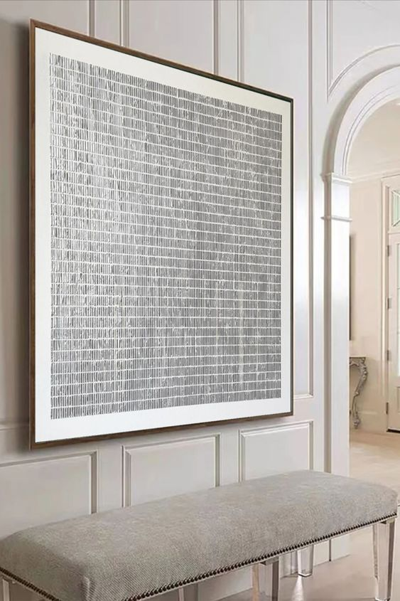 wabi sabi living room decor featuring large square grid textured painting