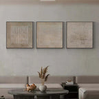 Minimalist textured triptych wall art in serene bedroom with soft natural lighting