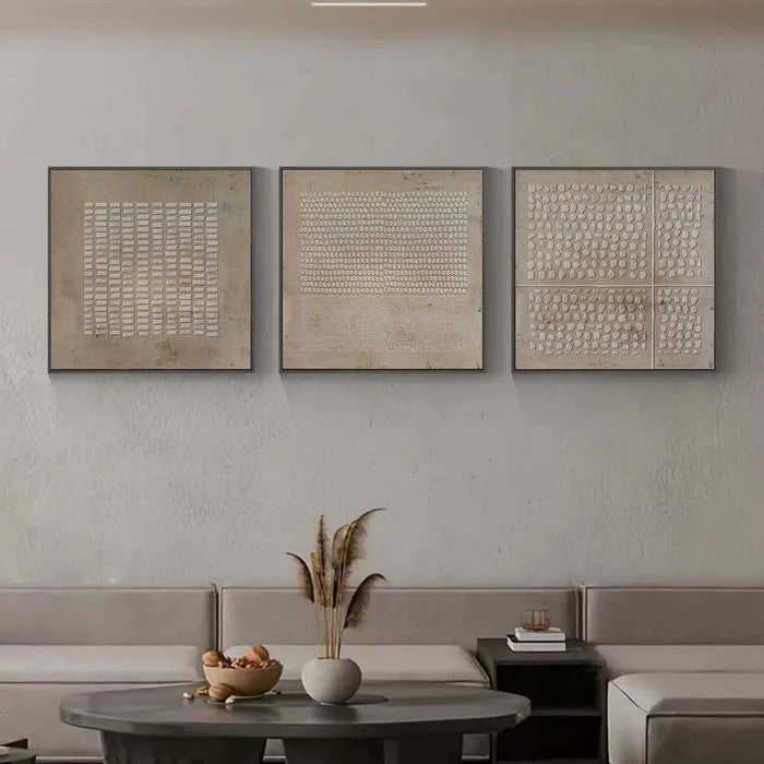 Minimalist textured triptych wall art in serene bedroom with soft natural lighting