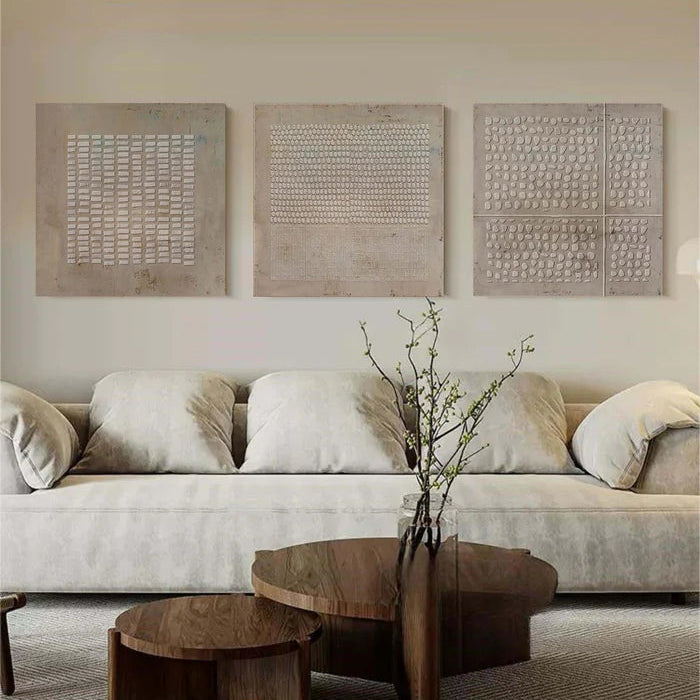 Abstract textured panel art set styled in modern luxury living room with stone and wood accents