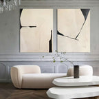 Neutral tone textured wall art diptych creating a calm aesthetic over a master bedroom headboard.