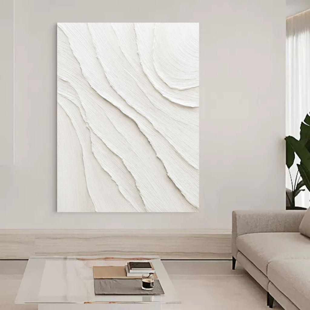 Modern heavy impasto plaster painting creating a serene aesthetic over a master bedroom headboard.