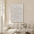 Cozy feminine master bedroom decor featuring vertical heavy textured white flower artwork above the bed