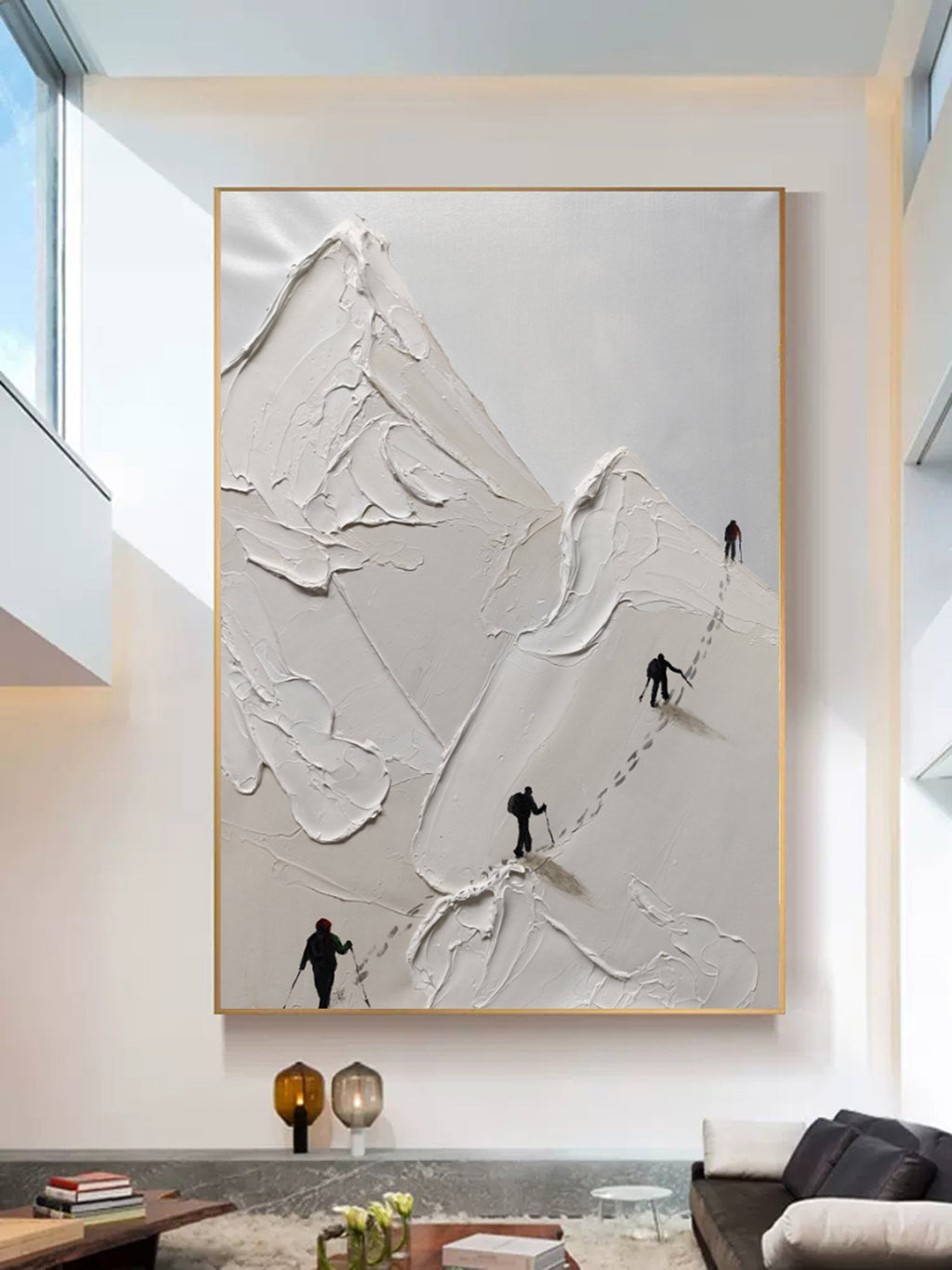 Large white textured mountain canvas painting hanging above a minimalist sofa in a modern living room