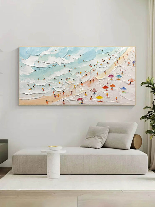 Extra wide colorful beach landscape canvas painting beautifully framed and hung directly above a large living room sofa.