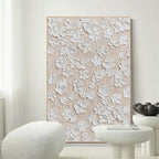 3D plaster relief botanical wall art with cream tones styling an elegant dining room wall