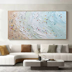 Cozy coastal style master bedroom decor featuring horizontal heavy textured aerial sea wave artwork above the bed