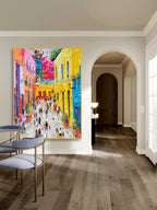 Vibrant impasto cityscape oil painting creating an energetic and artistic focal point in a master bedroom.