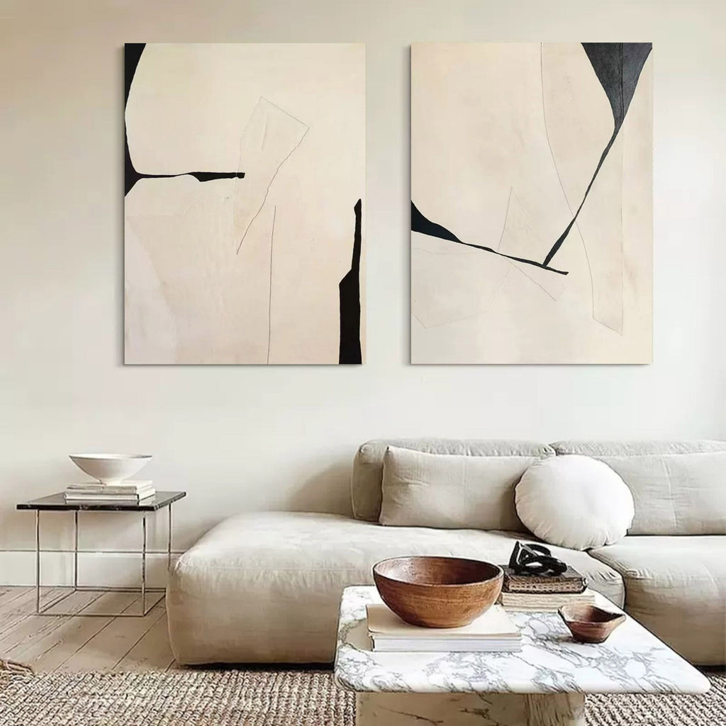 Large minimalist abstract canvas art set displayed beautifully above a modern living room sofa.