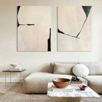 Large minimalist abstract canvas art set displayed beautifully above a modern living room sofa.