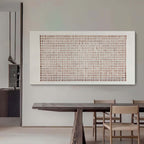 Close-up of Lattice textured wall art showing handcrafted plaster grid pattern and earthy terracotta accents