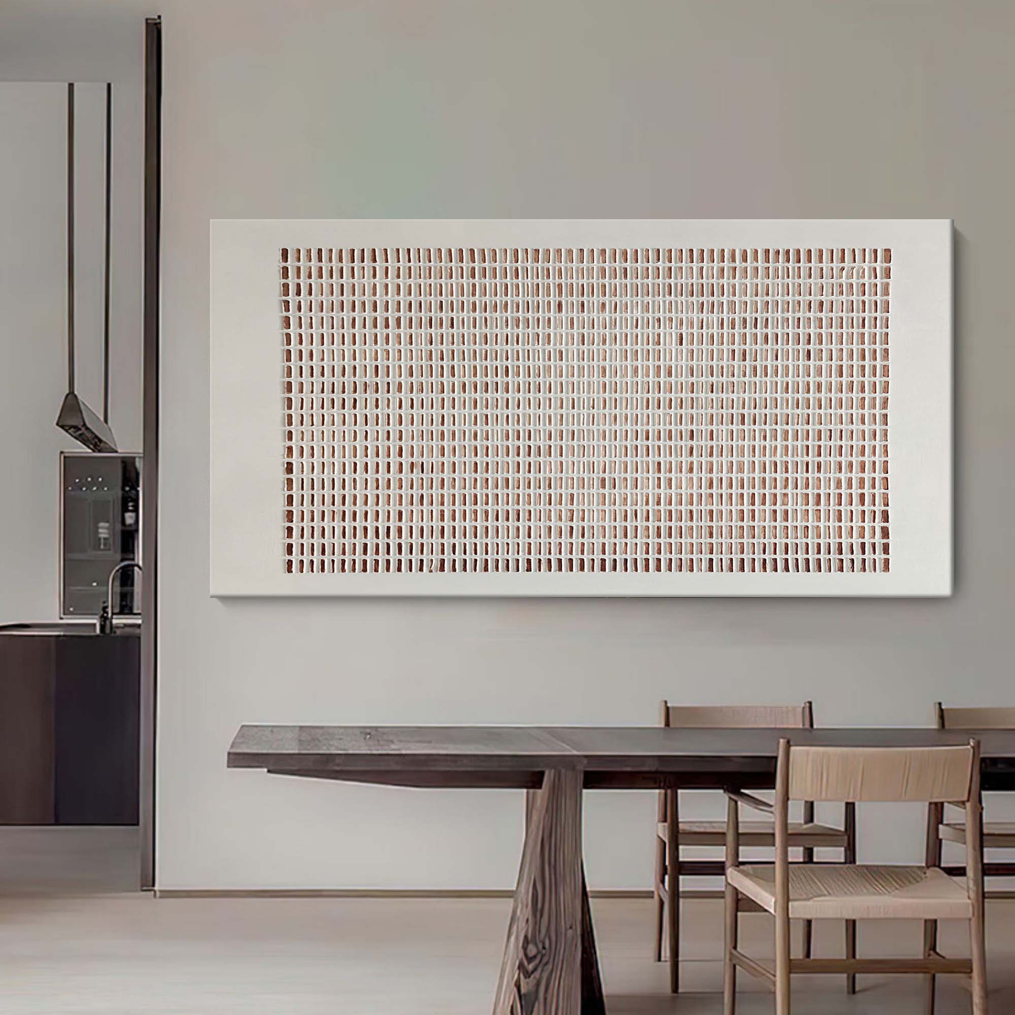 Close-up of Lattice textured wall art showing handcrafted plaster grid pattern and earthy terracotta accents