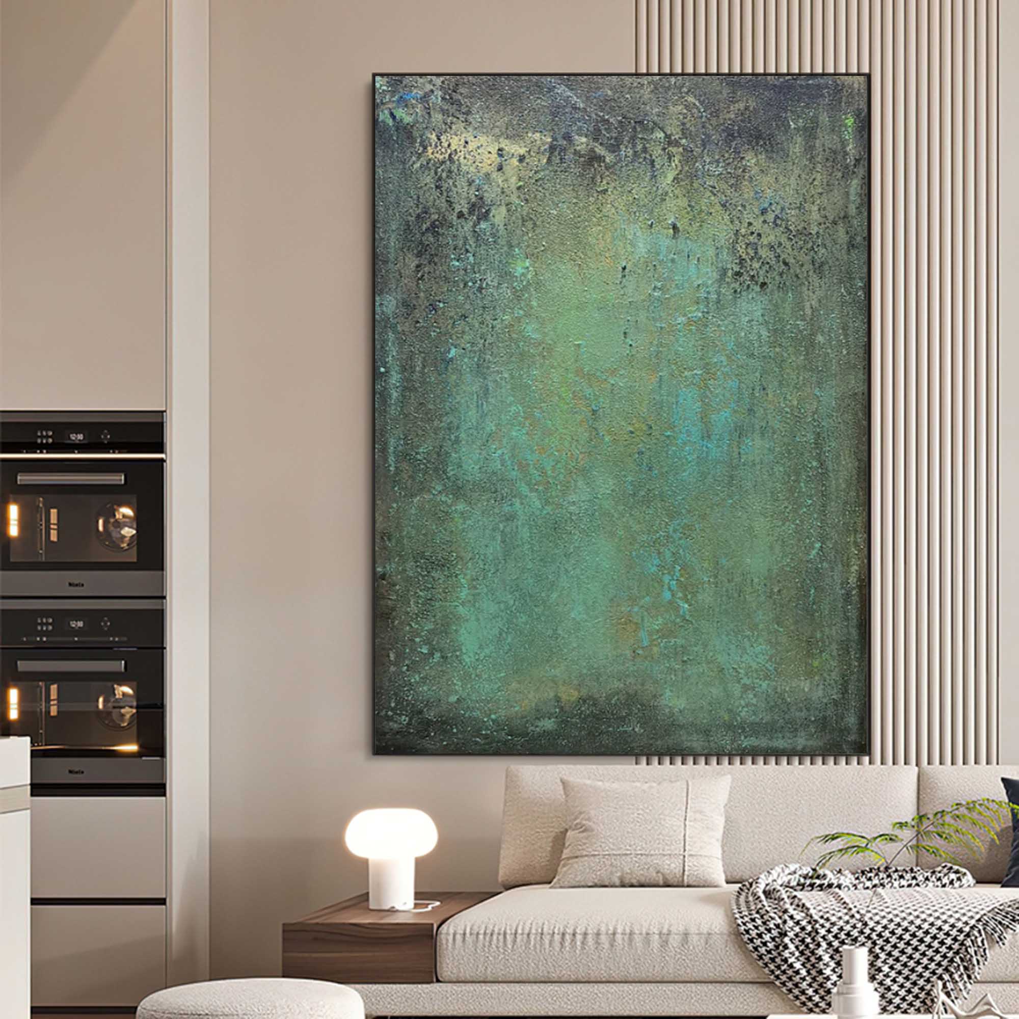 Modern textured green canvas painting styled in luxury living room with natural materials