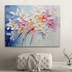 Modern colorful abstract blossom oil artwork mounted above a wooden console table in a minimalist home entryway with gallery lighting