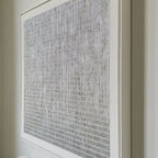 minimalist bedroom interiors with neutral plaster grid textured canvas art