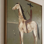 Large earthy green impasto horse painting effortlessly completing a rustic farmhouse living room over a leather couch.