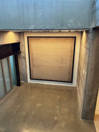 A large wabi-sabi framed abstract art print hangs in the hallway of the villa.