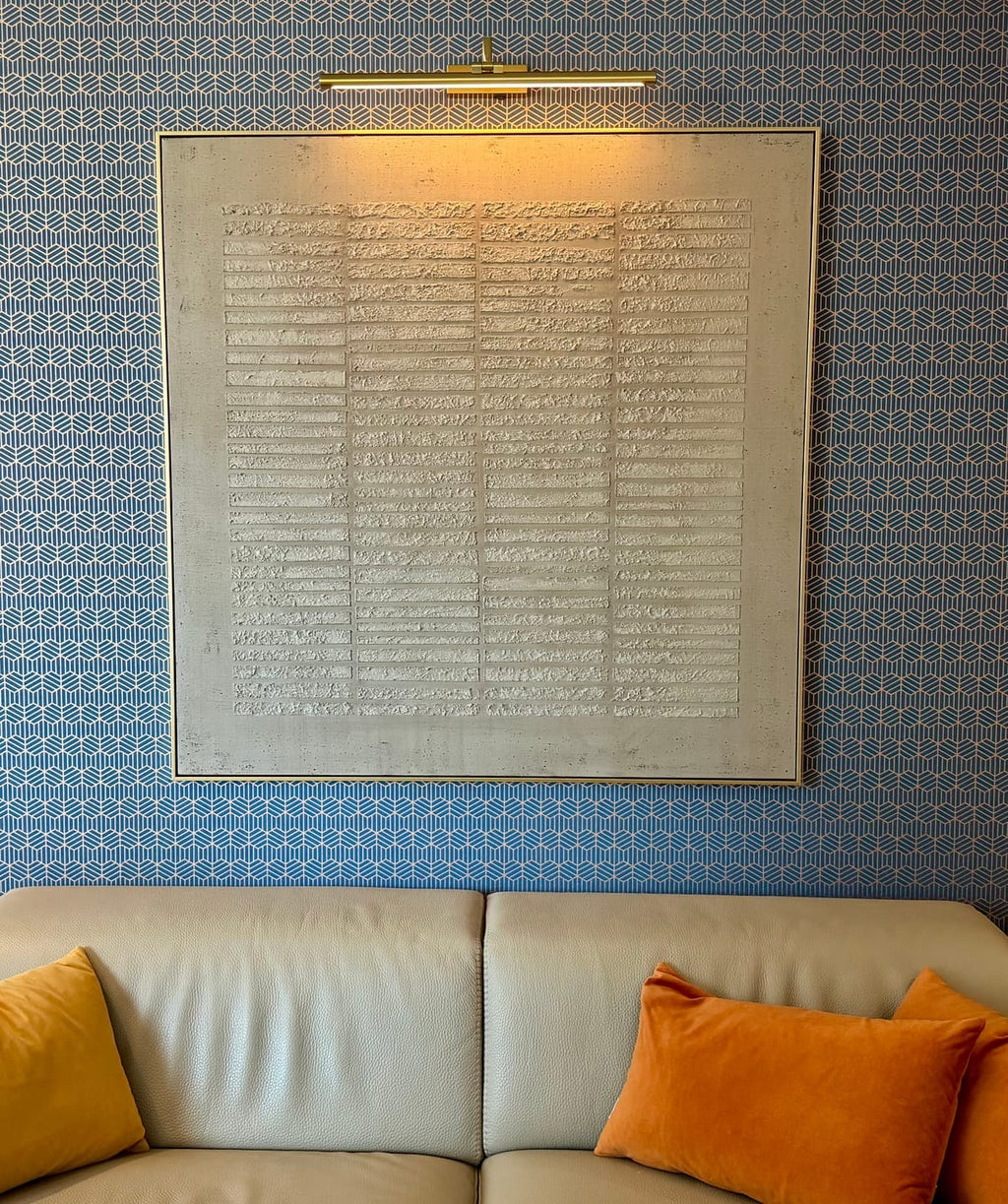 Beige Wabi Sabi wall art hanging above the living room sofa