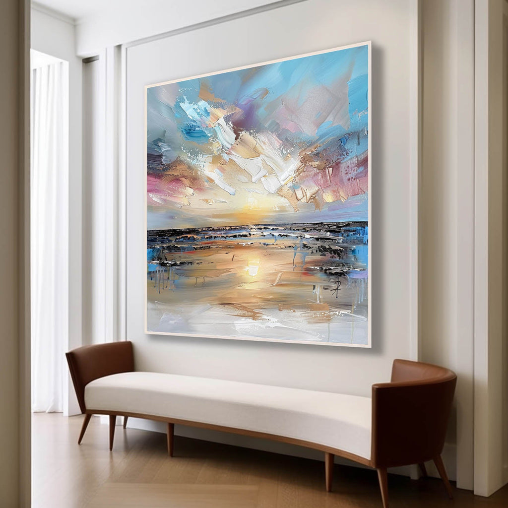 Large abstract ocean beach canvas painting perfectly styled above a comfortable sofa in a sunlit modern living room