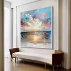 Large abstract ocean beach canvas painting perfectly styled above a comfortable sofa in a sunlit modern living room