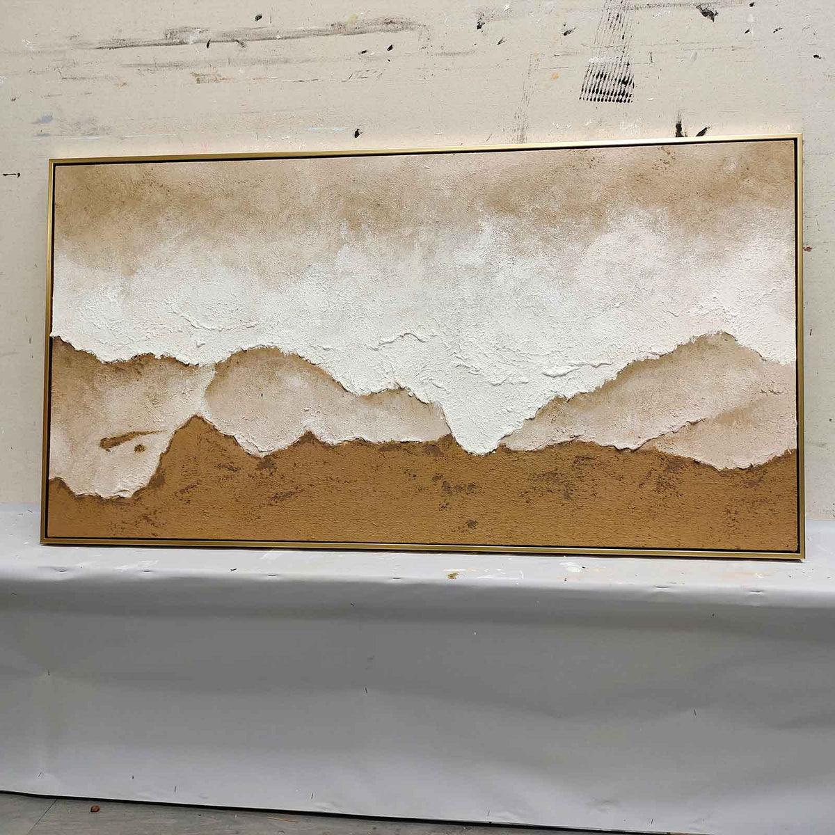 Sophisticated heavy textured panoramic coastal artwork adding calm inspiration and organic design to a home office.