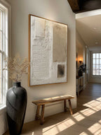 Beige and cream Wabi-Sabi abstract texture painting display over a designer nightstand in a high-end bedroom